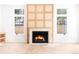 Bright living room with a modern fireplace, custom wood paneling, and natural light at 510 Glencoe St, Denver, CO 80220