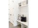Organized mudroom with built-in bench, storage cubbies, and coat closet at 510 Glencoe St, Denver, CO 80220