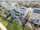 An aerial view of a beautiful two-story home showcasing the backyard with a stone patio at 11584 Pine Canyon Ln, Parker, CO 80138