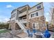 A multi-level backyard with a fire pit and seating area, perfect for outdoor entertaining at 11584 Pine Canyon Ln, Parker, CO 80138