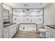 Beautiful bathroom with a frameless glass shower enclosure, double sinks, and wood-look flooring at 11584 Pine Canyon Ln, Parker, CO 80138
