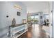Welcoming entryway featuring hardwood floors, stylish console table, and views into the dining and living spaces at 11584 Pine Canyon Ln, Parker, CO 80138