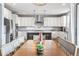 Open concept kitchen with island and seating is seamlessly connected to the dining area at 11584 Pine Canyon Ln, Parker, CO 80138