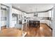 Spacious kitchen with white cabinets, stainless steel appliances, and a large center island, perfect for entertaining at 11584 Pine Canyon Ln, Parker, CO 80138