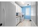 Laundry room featuring a washer and dryer, sink and cabinet area, and tile floor, and natural light at 11584 Pine Canyon Ln, Parker, CO 80138
