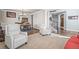 Inviting living room with hardwood floors, comfortable seating, and views into the dining area and staircase at 11584 Pine Canyon Ln, Parker, CO 80138
