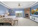 Spacious main bedroom boasts a fireplace, a ceiling fan, and sliding doors to a private balcony at 11584 Pine Canyon Ln, Parker, CO 80138