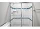 Shower with sliding glass doors, white tile, decorative accent tiles, and chrome fixtures at 11584 Pine Canyon Ln, Parker, CO 80138
