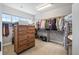 Organized walk-in closet with shelving, drawers, and ample storage space at 11584 Pine Canyon Ln, Parker, CO 80138