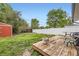 A well-maintained yard with a deck, shed, and a white privacy fence at 865 S 8Th Ave, Brighton, CO 80601