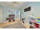 Charming ' bedroom with a dollhouse, book shelves, and hardwood floors at 865 S 8Th Ave, Brighton, CO 80601