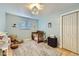 Playful bedroom with light blue walls, wooden floor, and a large window at 865 S 8Th Ave, Brighton, CO 80601