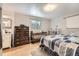 Bright bedroom featuring light wood floors, a crib, and plenty of natural light at 865 S 8Th Ave, Brighton, CO 80601