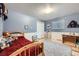 Charming bedroom with a red bedspread and neutral color carpet, perfect for a room at 865 S 8Th Ave, Brighton, CO 80601