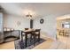 Cozy dining area with a modern chandelier and an adjacent view of another dining space at 865 S 8Th Ave, Brighton, CO 80601