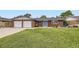 Charming brick home with a well-maintained lawn and a welcoming blue front door at 865 S 8Th Ave, Brighton, CO 80601