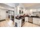 Bright kitchen featuring white cabinets, black countertops, stainless steel appliances, and tile flooring at 865 S 8Th Ave, Brighton, CO 80601