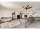 Comfortable living room with a fireplace, ceiling fan, and carpeted floor at 865 S 8Th Ave, Brighton, CO 80601