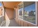 Private balcony with wood flooring overlooking a neighborhood at 9654 Browns Peak Cir, Littleton, CO 80125