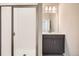 Bright bathroom with glass enclosed shower and modern vanity at 9654 Browns Peak Cir, Littleton, CO 80125