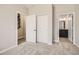 Bedroom with open doorway to a bathroom and stairwell at 9654 Browns Peak Cir, Littleton, CO 80125