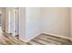 Bedroom featuring wood floors, neutral walls, and two doors at 9654 Browns Peak Cir, Littleton, CO 80125