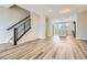 Open-concept living area featuring wood floors and staircase at 9654 Browns Peak Cir, Littleton, CO 80125