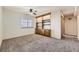 Finished basement recreation room with built-in shelving at 7851 S Quatar Ct, Aurora, CO 80016