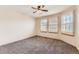 Well-lit bedroom with bay windows and ceiling fan at 7851 S Quatar Ct, Aurora, CO 80016