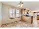 Kitchen features granite countertops, wood cabinets, and breakfast nook at 7851 S Quatar Ct, Aurora, CO 80016