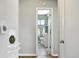 Hallway view of updated bathroom with modern fixtures at 2955 Poplar St, Denver, CO 80207