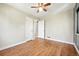 Empty bedroom featuring hardwood floors and natural light at 2955 Poplar St, Denver, CO 80207