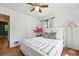 Inviting bedroom with hardwood floors, ceiling fan and bright accents at 2955 Poplar St, Denver, CO 80207