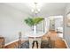 Charming dining room featuring hardwood floors and view to the adjacent living area at 2955 Poplar St, Denver, CO 80207