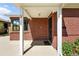 Covered entryway featuring brick facade and view of the home number at 2955 Poplar St, Denver, CO 80207