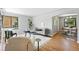 Bright living room with hardwood floors, modern decor, and large window at 2955 Poplar St, Denver, CO 80207