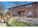 Charming brick townhouse complex with mature trees and well-maintained landscaping at 3744 Miller Ct, Wheat Ridge, CO 80033