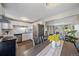 Bright kitchen features stainless steel appliances, subway tile backsplash, and access to the dining room at 3744 Miller Ct, Wheat Ridge, CO 80033