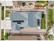 Aerial view of a home featuring a well-manicured yard, patio, and hot tub at 8234 S Vandriver Way, Aurora, CO 80016