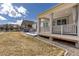 Backyard features a covered patio ideal for outdoor living at 8234 S Vandriver Way, Aurora, CO 80016