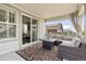 Cozy outdoor balcony with comfortable seating and a view of the surrounding neighborhood at 8234 S Vandriver Way, Aurora, CO 80016