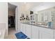 Bright bathroom boasts double vanity, granite counters, and convenient access to walk-in closet at 8234 S Vandriver Way, Aurora, CO 80016