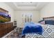 Bright bedroom with a tray ceiling, large window, and stylish furnishings provides a relaxing retreat at 8234 S Vandriver Way, Aurora, CO 80016