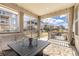Relaxing covered patio features an outdoor living space at 8234 S Vandriver Way, Aurora, CO 80016