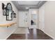Inviting entryway with dark wood floors, a white door, and modern decorative accents at 8234 S Vandriver Way, Aurora, CO 80016