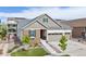 Beautiful single-Gathering home with a three-car garage and landscaped front yard at 8234 S Vandriver Way, Aurora, CO 80016
