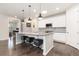 Bright kitchen featuring granite counters, pendant lighting, and stainless steel appliances at 8234 S Vandriver Way, Aurora, CO 80016