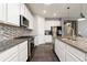 Spacious kitchen with granite counters, stainless appliances, and ample cabinet space at 8234 S Vandriver Way, Aurora, CO 80016