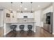 Modern kitchen with granite counters, stainless steel appliances, and a large island with seating at 8234 S Vandriver Way, Aurora, CO 80016