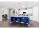 Well-equipped kitchen with white cabinetry, stainless steel appliances, and a functional island at 8234 S Vandriver Way, Aurora, CO 80016